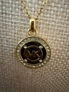 Michael Kors MK Logo Rhinestone Gold Tone Pendant Necklace
